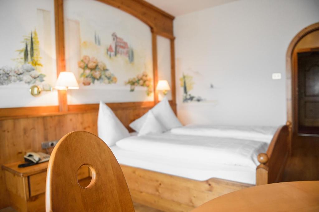 Postel nebo postele na pokoji v ubytování Hotel Rochushof