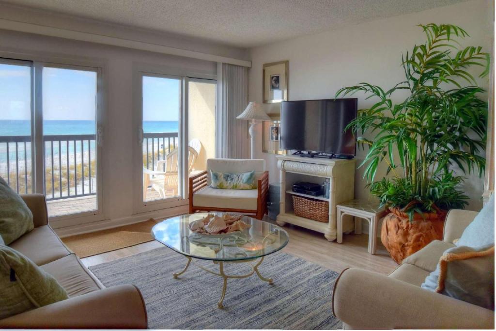 a living room with a view of the ocean at Pinnacle Port C1-203 in Carillon Beach