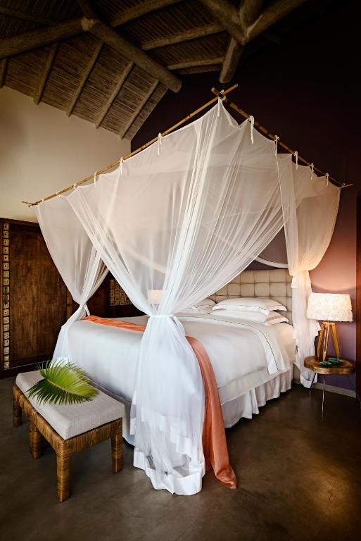 Postel nebo postele na pokoji v ubytování Campo Bahia Hotel Villas Spa
