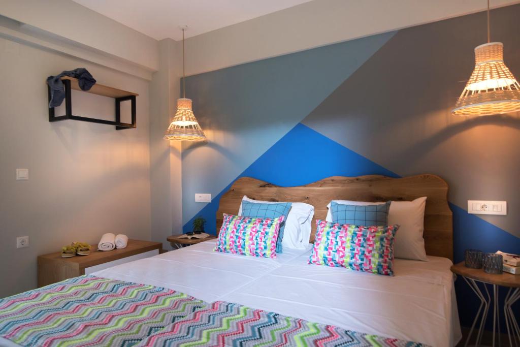 Posteľ alebo postele v izbe v ubytovaní Natali Apartments