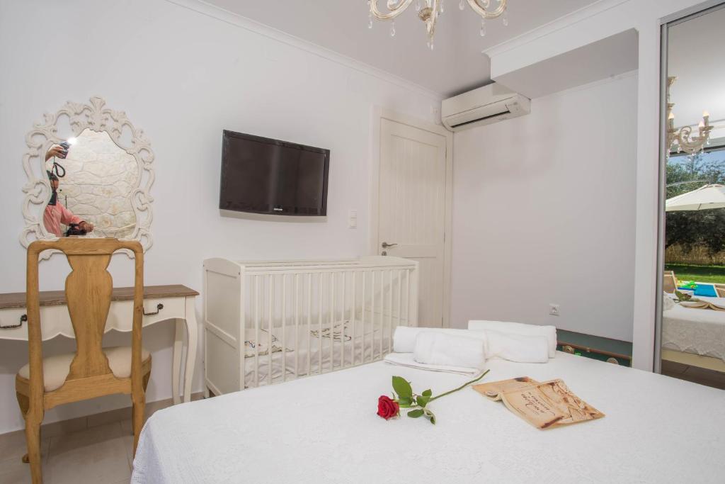 A bed or beds in a room at Alexandros Stone House