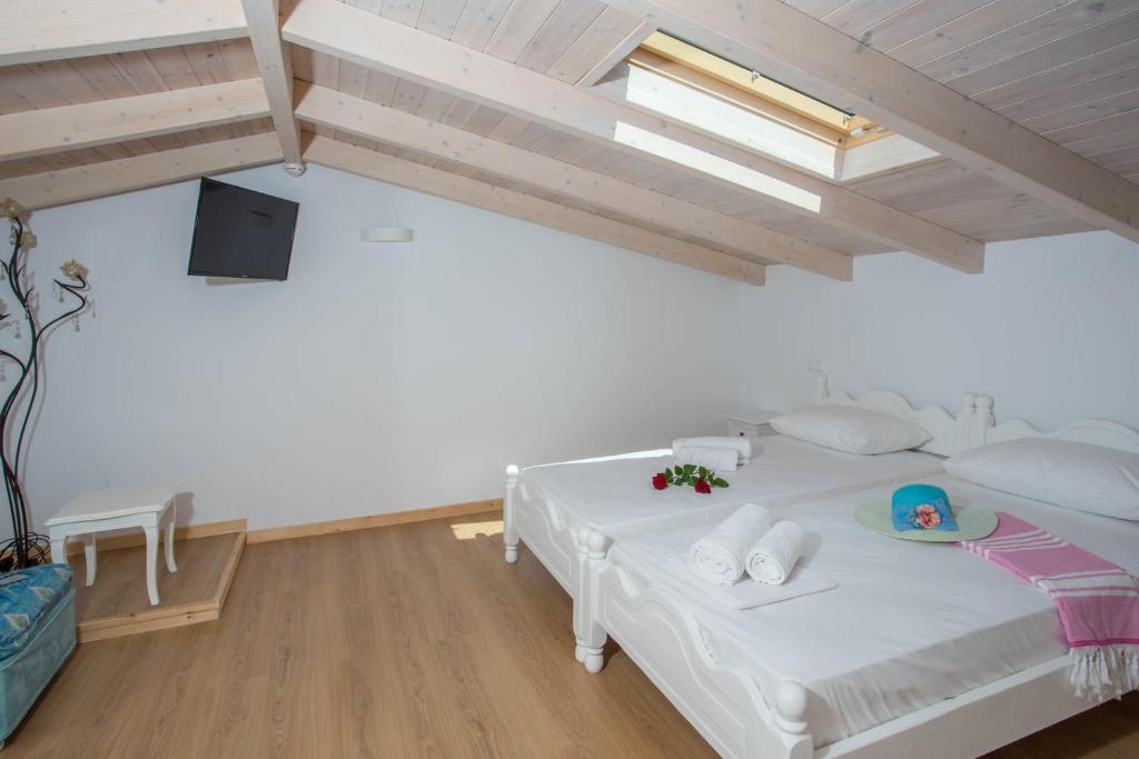 A bed or beds in a room at Alexandros Stone House