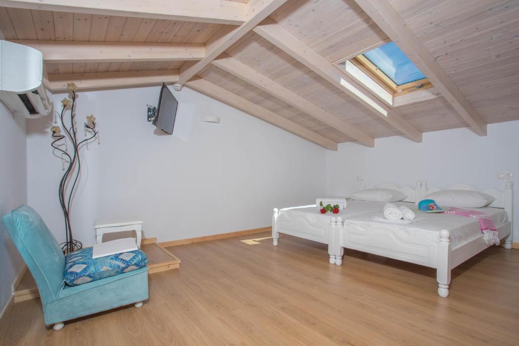 A bed or beds in a room at Alexandros Stone House