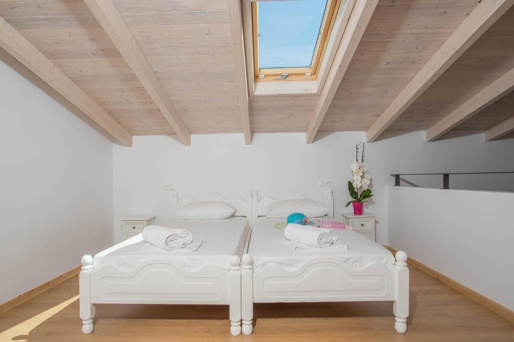 A bed or beds in a room at Alexandros Stone House