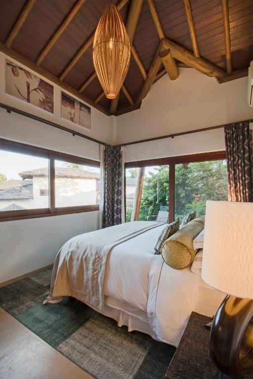 Postel nebo postele na pokoji v ubytování Campo Bahia Hotel Villas Spa