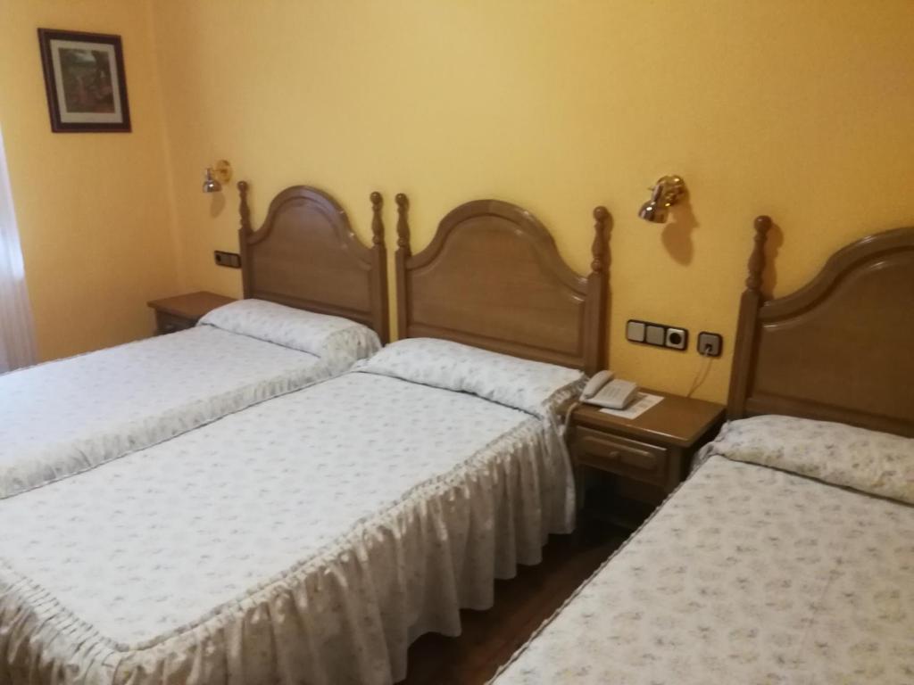 Postel nebo postele na pokoji v ubytování Hotel Xabier