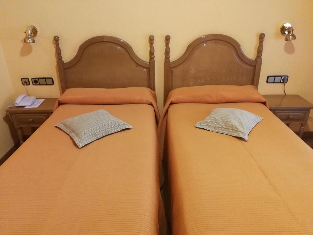 Postel nebo postele na pokoji v ubytování Hotel Xabier