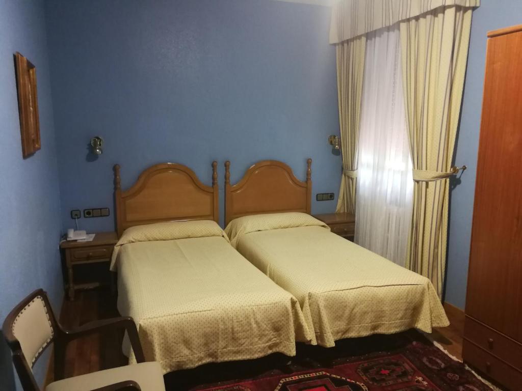 Postel nebo postele na pokoji v ubytování Hotel Xabier