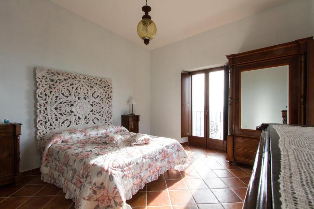 A bed or beds in a room at La Rossa Fantastica