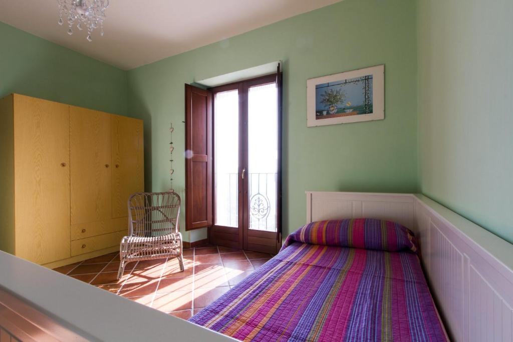 A bed or beds in a room at La Rossa Fantastica
