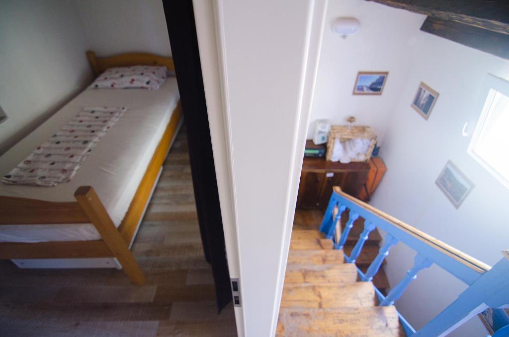 Postel nebo postele na pokoji v ubytování Traditional Piran house