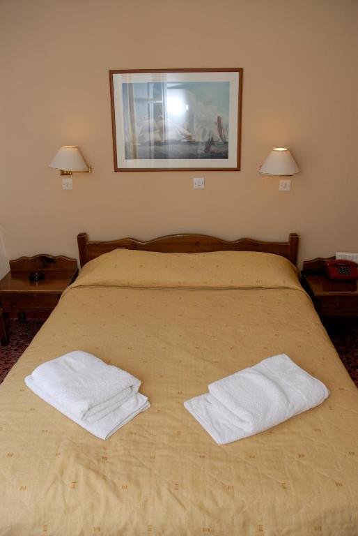 Cama o camas de una habitación en Amaryllis Hotel