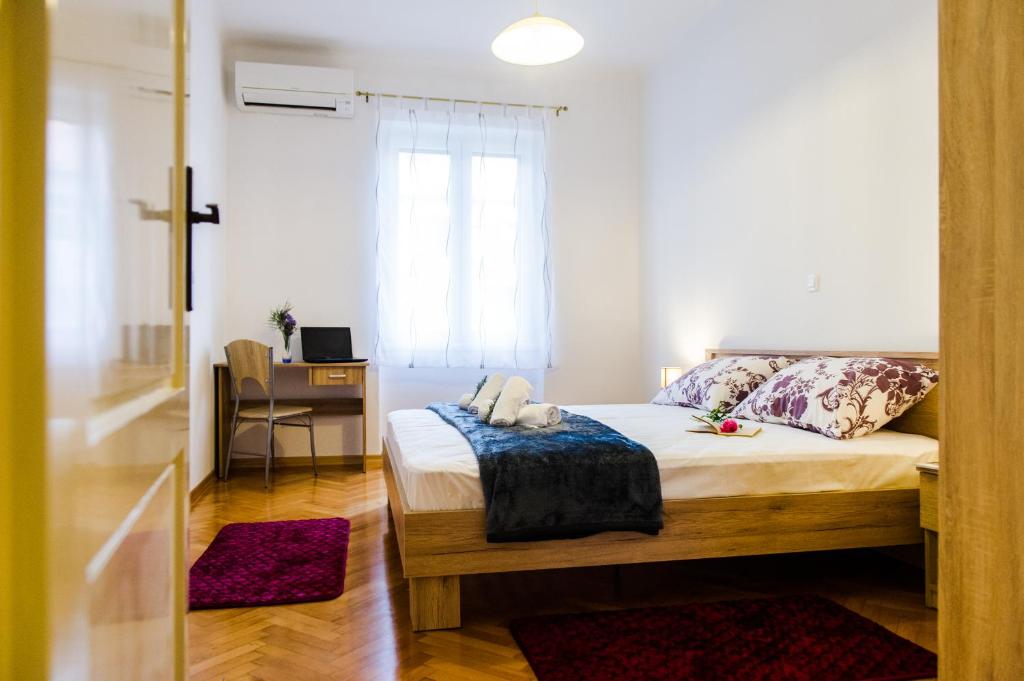 Posteľ alebo postele v izbe v ubytovaní Dundo Baldo Apartment