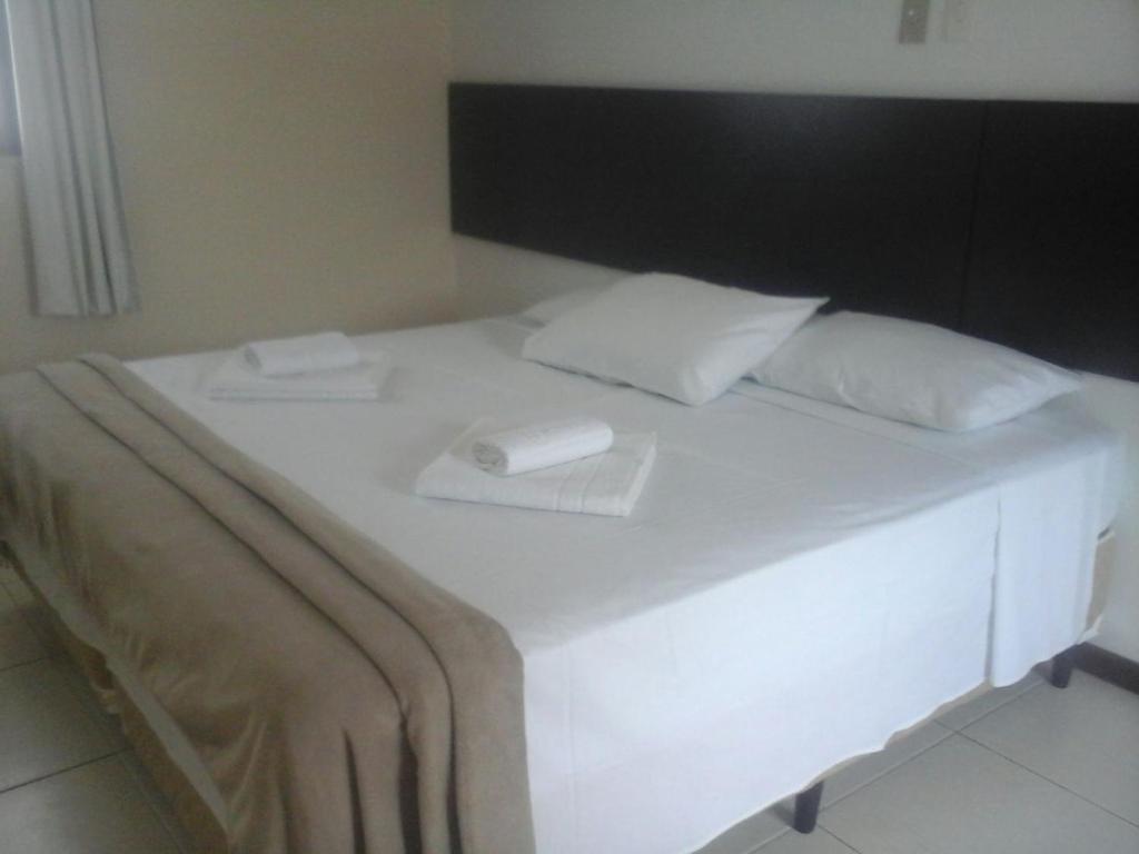 Postel nebo postele na pokoji v ubytování Hotel Pousada Trevo
