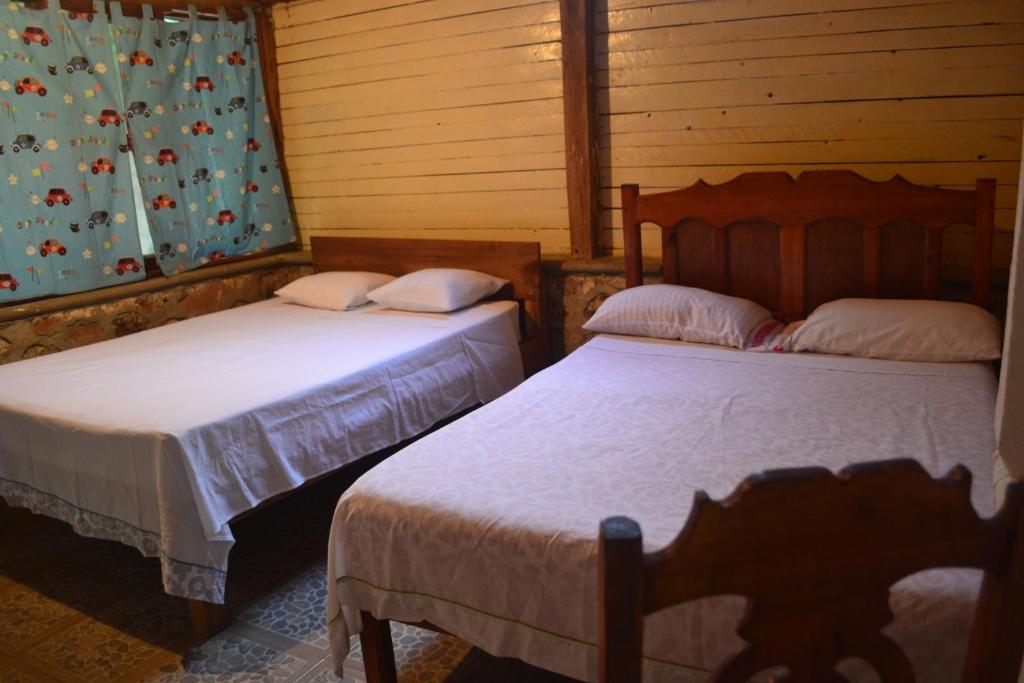 Postel nebo postele na pokoji v ubytování Posada los Reyecitos
