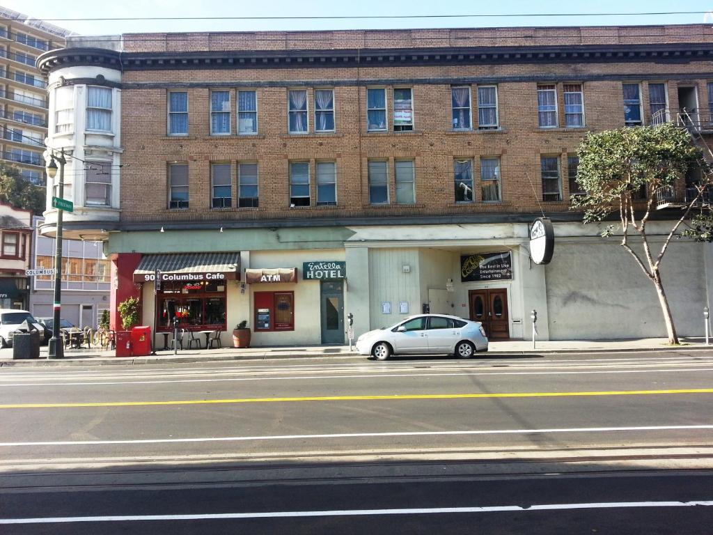 a car parked in front of a building on a street at Entella Hotel in San Francisco