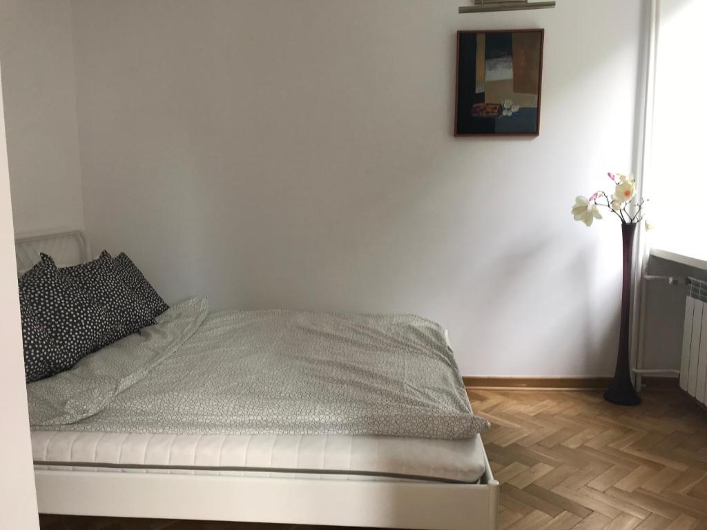 Posteľ alebo postele v izbe v ubytovaní Nina na Bielańskiej