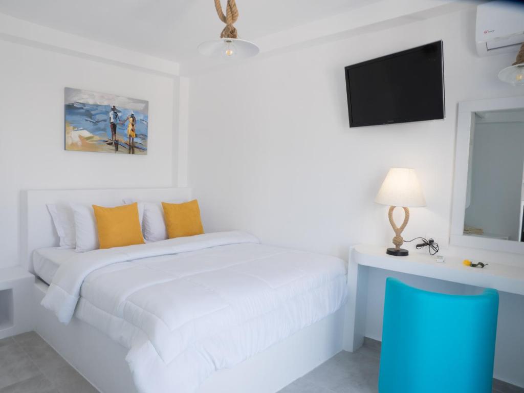 Postel nebo postele na pokoji v ubytování Amaryllis Beach Hotel