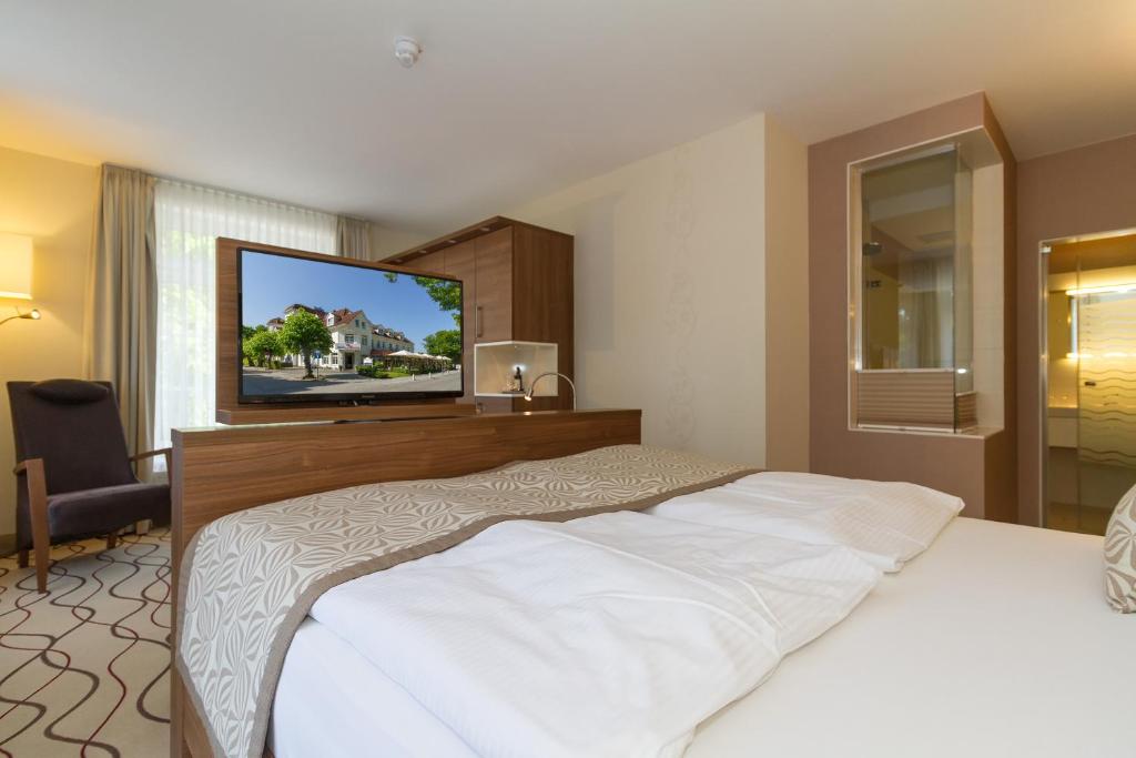 Postel nebo postele na pokoji v ubytování HOTEL am STRAND