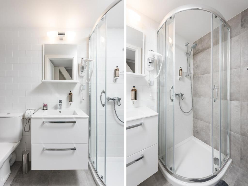 Split-perspective view of sink vanity and curved glass shower, white tiles and gray accents