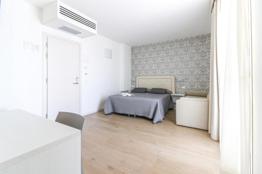 Postel nebo postele na pokoji v ubytování Hotel Jesulum