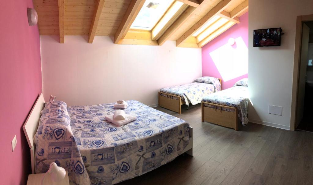 Postel nebo postele na pokoji v ubytování Hotel Mojito