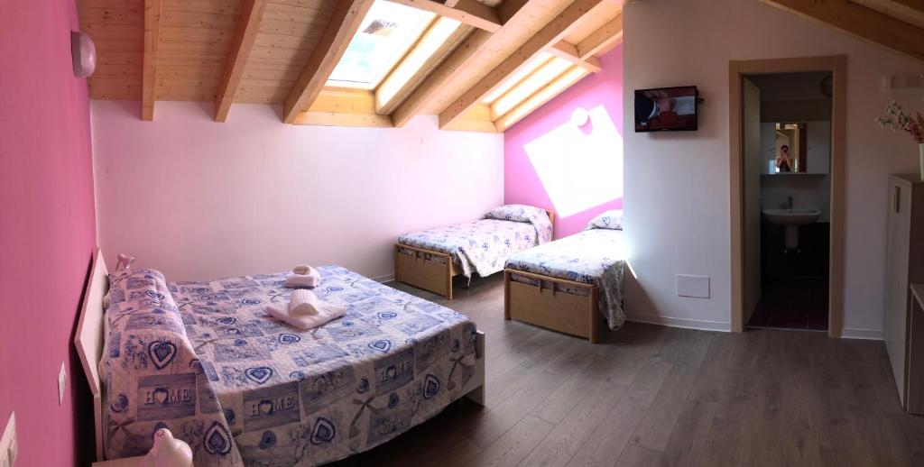 Postel nebo postele na pokoji v ubytování Hotel Mojito
