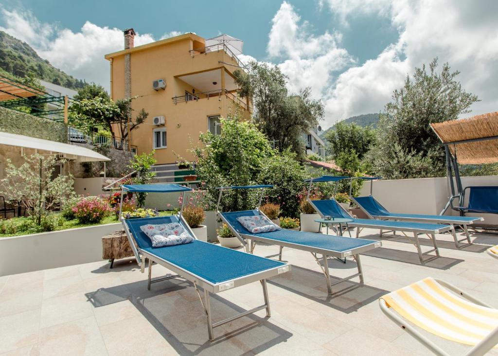 a group of chairs and tables on a patio at Apartment Panorama in Kotor