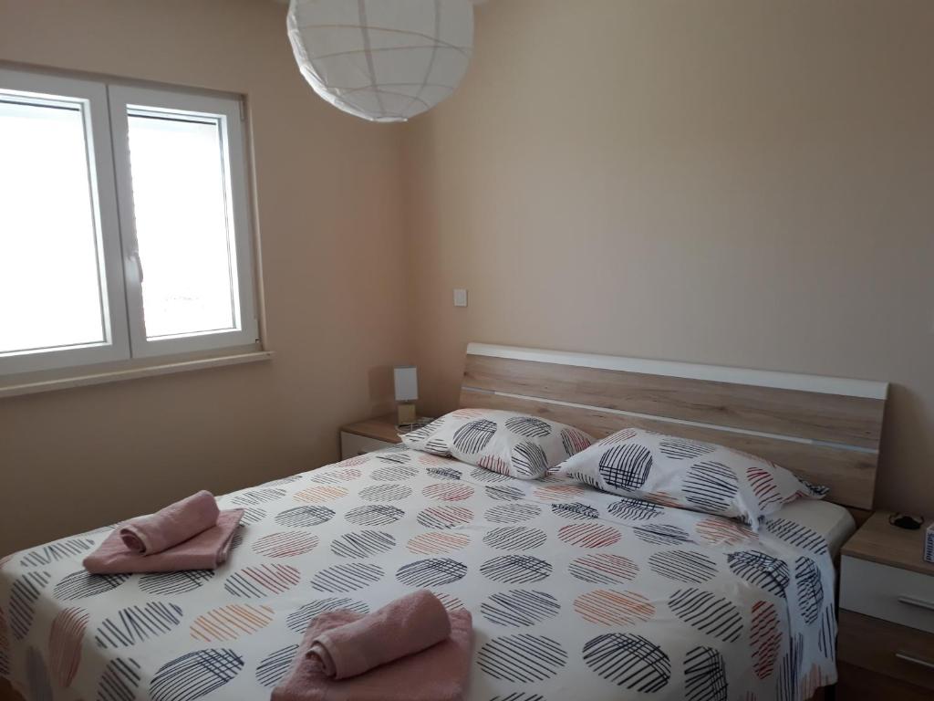 Posteľ alebo postele v izbe v ubytovaní Apartments Juliet