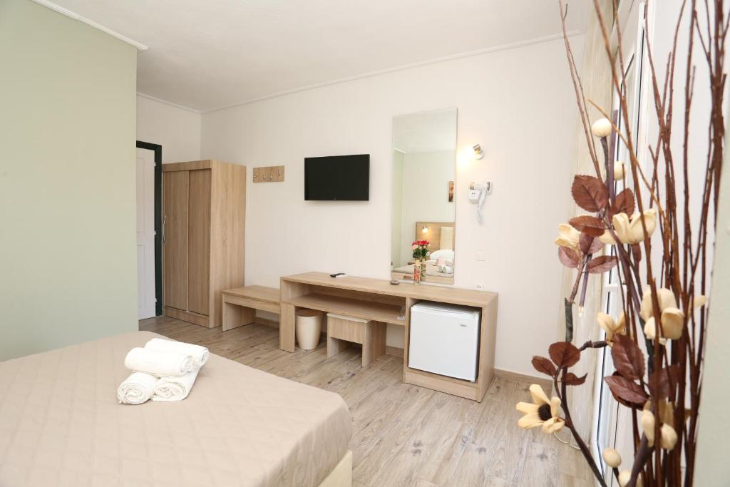 Posteľ alebo postele v izbe v ubytovaní Sun Hotel