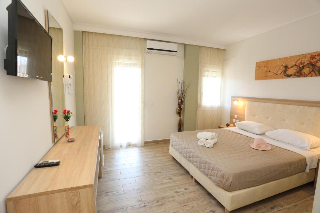 Posteľ alebo postele v izbe v ubytovaní Sun Hotel