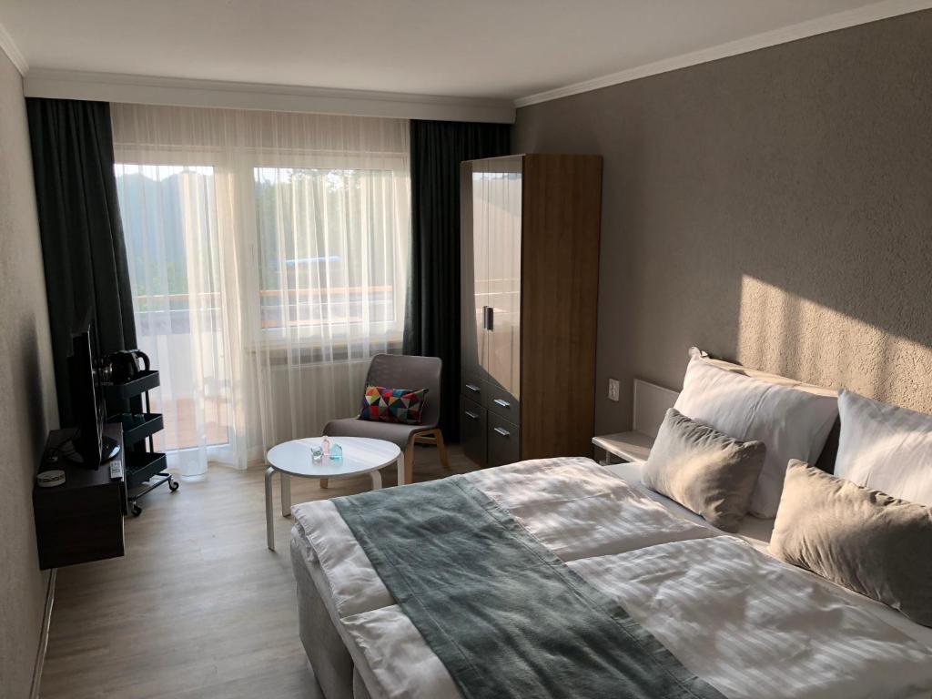Postel nebo postele na pokoji v ubytování Fi-Suiten
