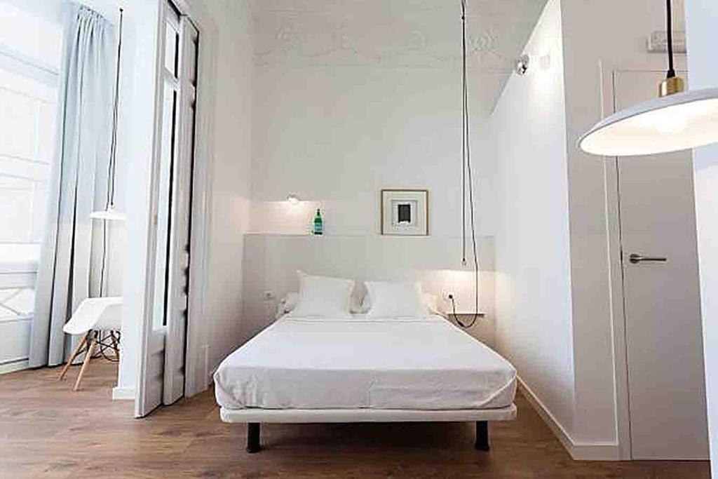 Posteľ alebo postele v izbe v ubytovaní Hostal Argo