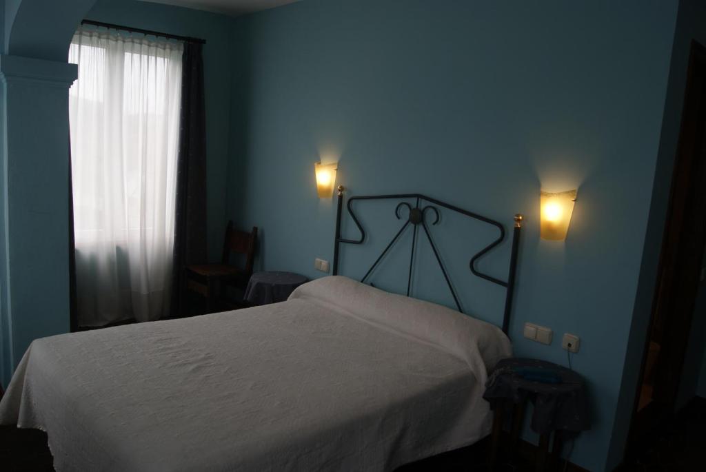 Postel nebo postele na pokoji v ubytování Hotel Los Laureles