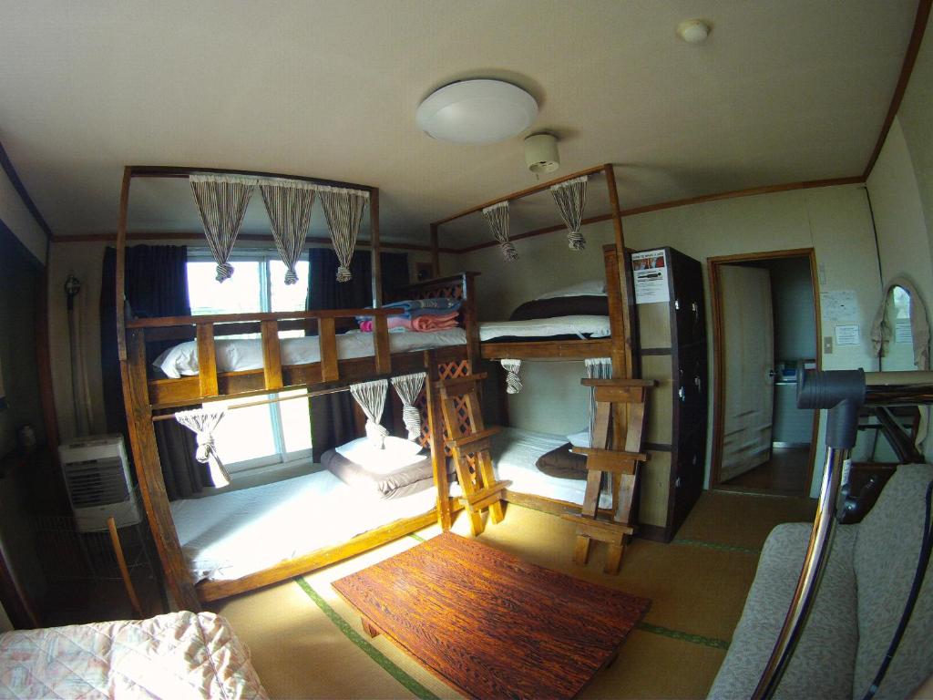 Postel nebo postele na pokoji v ubytování P-Dash Garden Backpackers