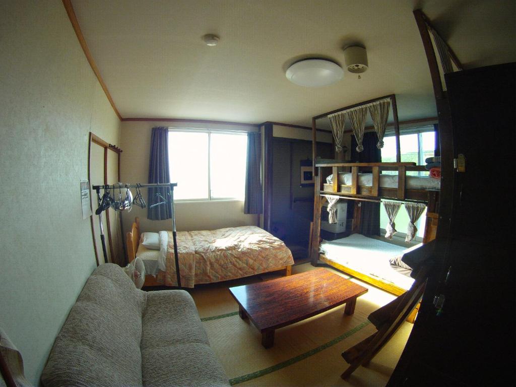 Postel nebo postele na pokoji v ubytování P-Dash Garden Backpackers
