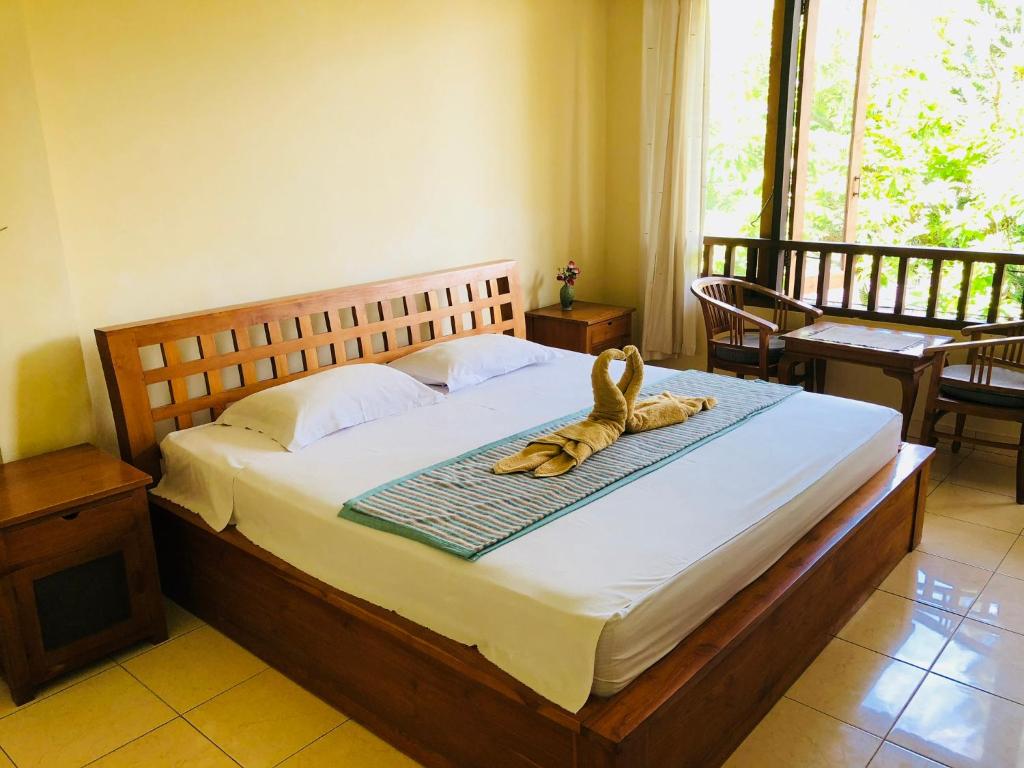 Postel nebo postele na pokoji v ubytování Padangbai Beach inn