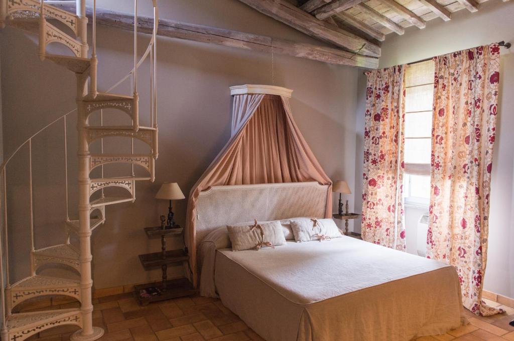 Katil atau katil-katil dalam bilik di Relais de Charme Villa Rossi Danielli