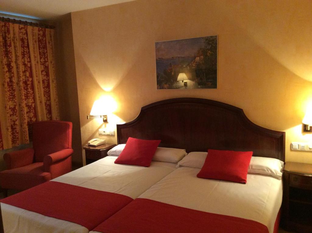 Postel nebo postele na pokoji v ubytování Hotel Cordón