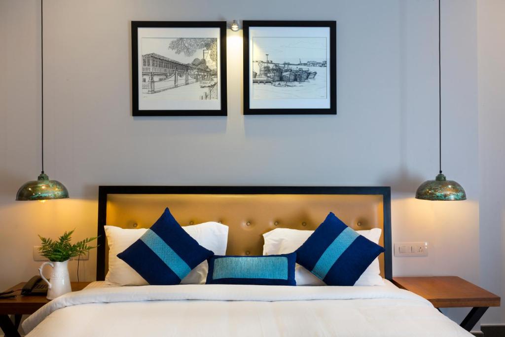 Postel nebo postele na pokoji v ubytování Hotel Neighbourhood, Cochin
