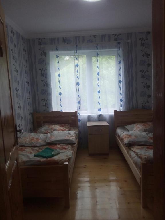 Postel nebo postele na pokoji v ubytování I R K O