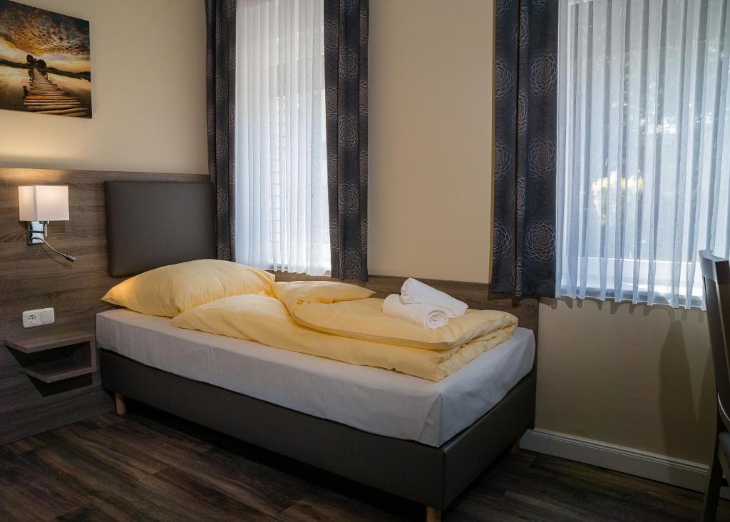 Postel nebo postele na pokoji v ubytování Hotel Dea