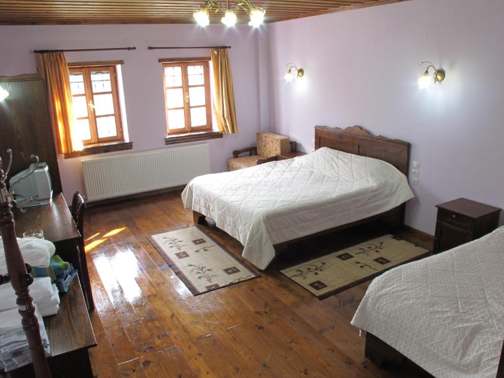 Postel nebo postele na pokoji v ubytování Manis Hotel