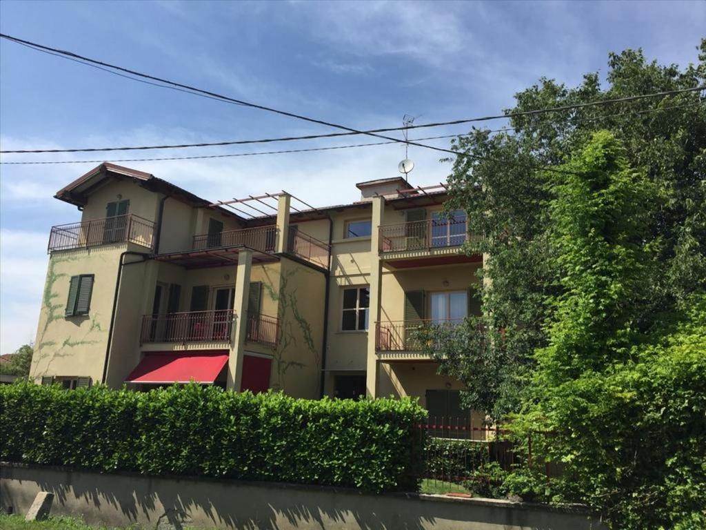 a large building with balconies on the side of it at Boutique Apartment Condominio Marengo in Spinetta Marengo