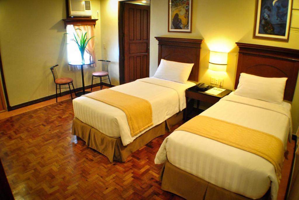 Postel nebo postele na pokoji v ubytování Fersal Hotel - P. Tuazon Cubao