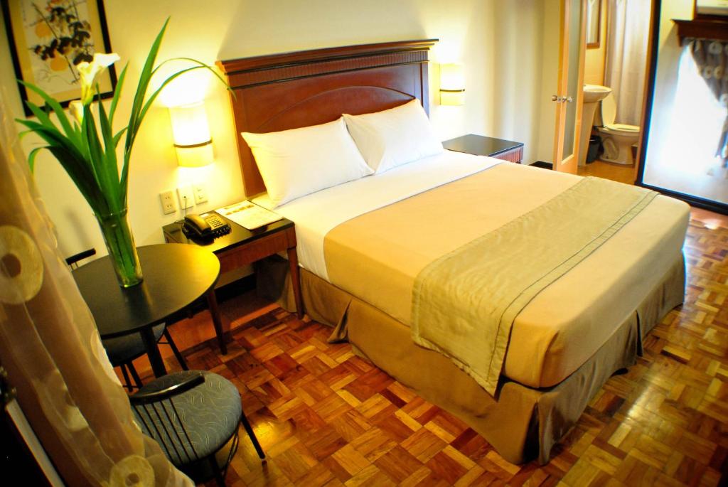 Postel nebo postele na pokoji v ubytování Fersal Hotel - P. Tuazon Cubao