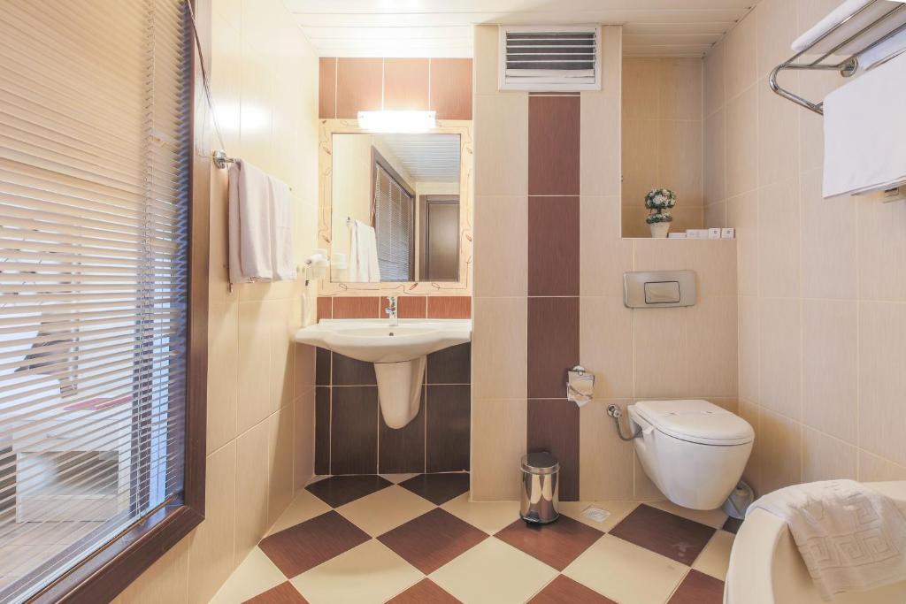 Koupelna v ubytování Hostapark Hotel