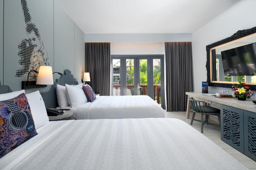 Postel nebo postele na pokoji v ubytování Hard Rock Hotel Bali