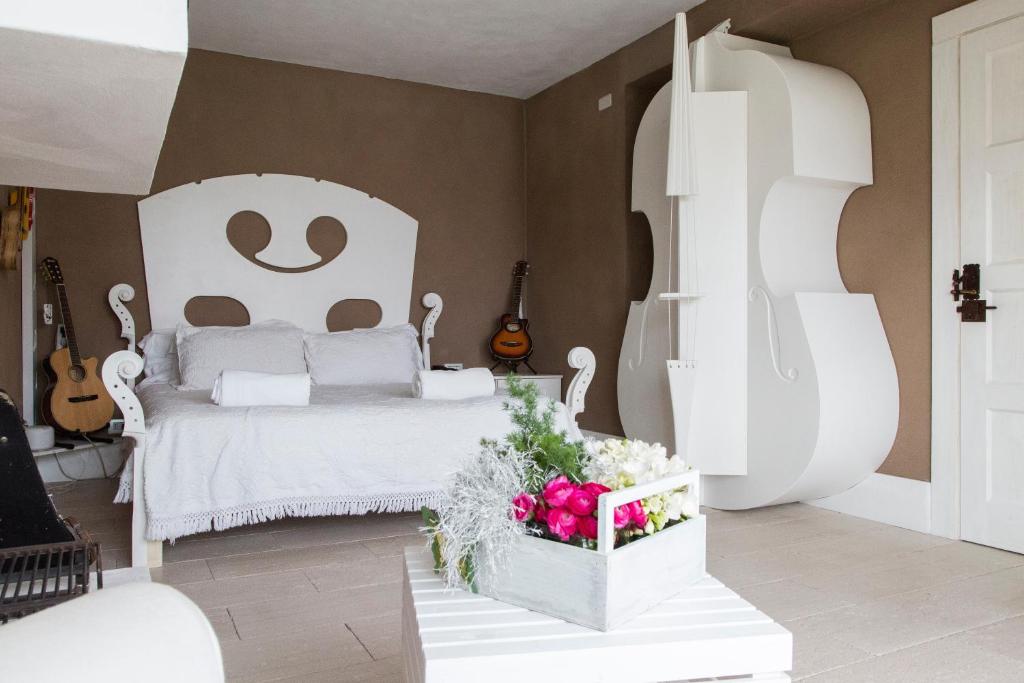 Łóżko lub łóżka w pokoju w obiekcie La Pampa Relais & Spa