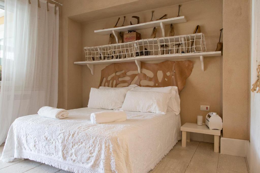 Łóżko lub łóżka w pokoju w obiekcie La Pampa Relais & Spa
